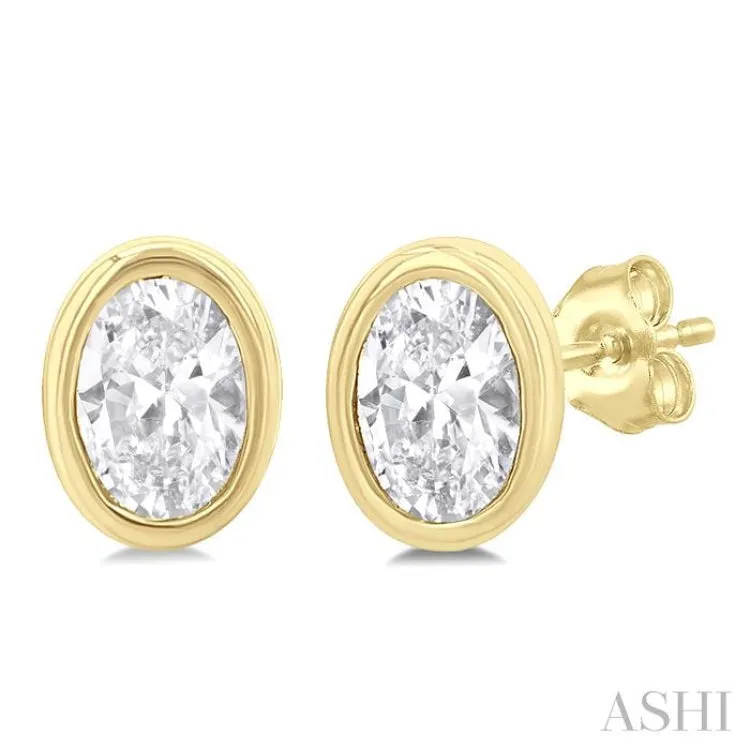 1/5 ctw Petite Bezel Set Oval Cut Diamond Fashion Stud Earring in 10K Yellow Gold